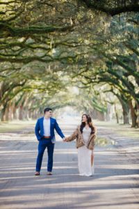 Carly wearing a velvet dress and fur for her Wormsloe engagement session
