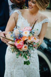 Colorful bouquet with peonies, garden roses and feathers by Harvey Designs