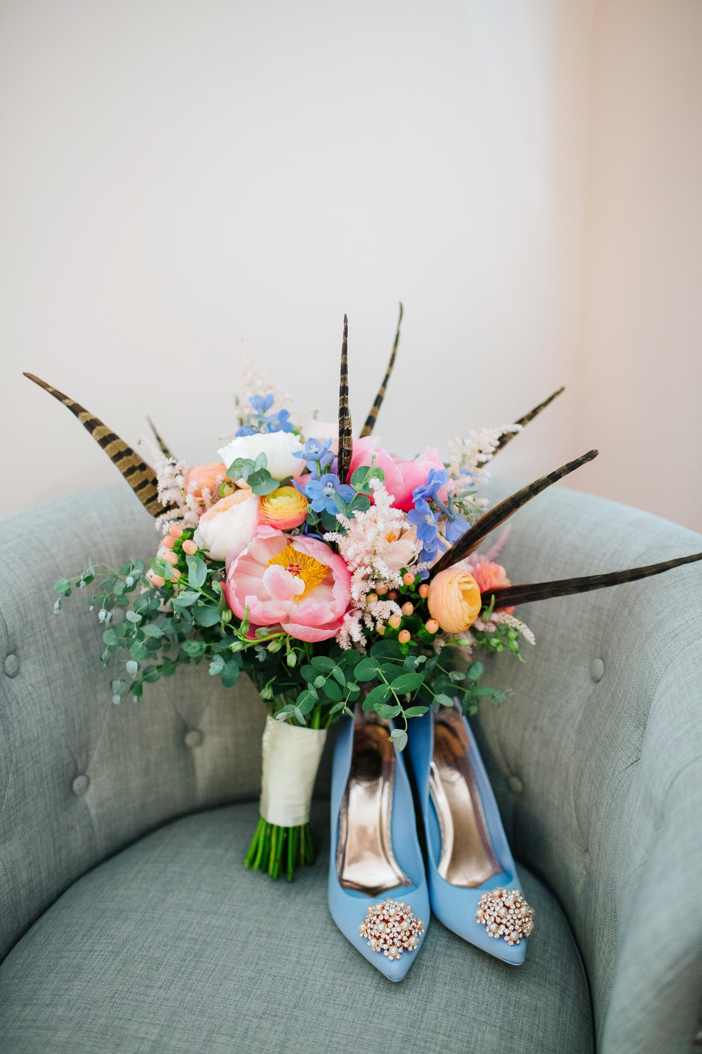 Colorful bouquet with peonies, garden roses and feathers by Harvey Designs