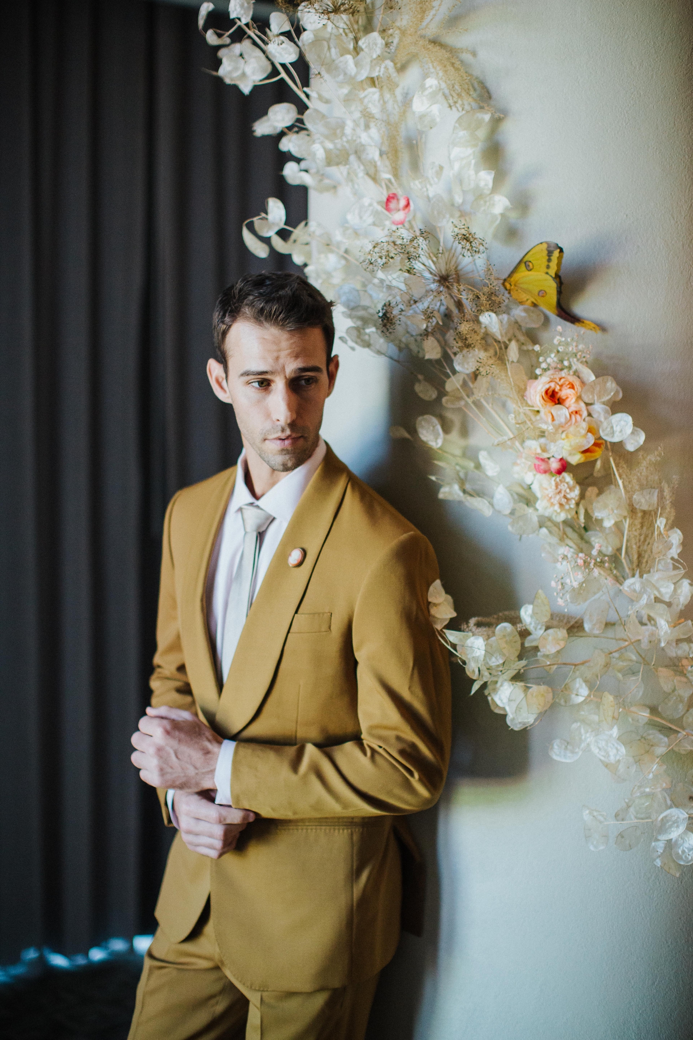 Groom in a Marigold Mustard Tuxedo from The Black Tux | Izzy and Co.