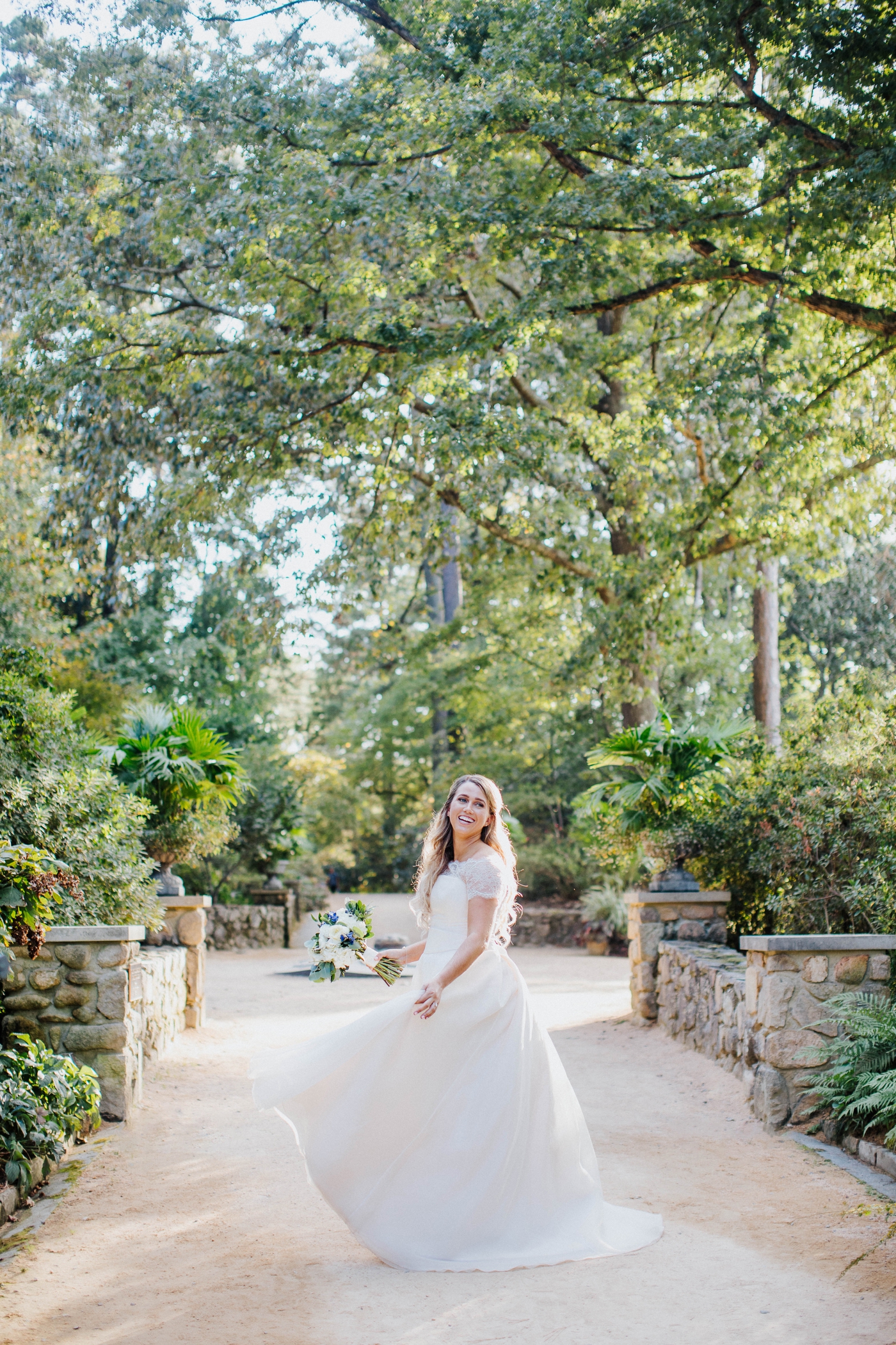 Bride in a custom satin and lace wedding ballgown