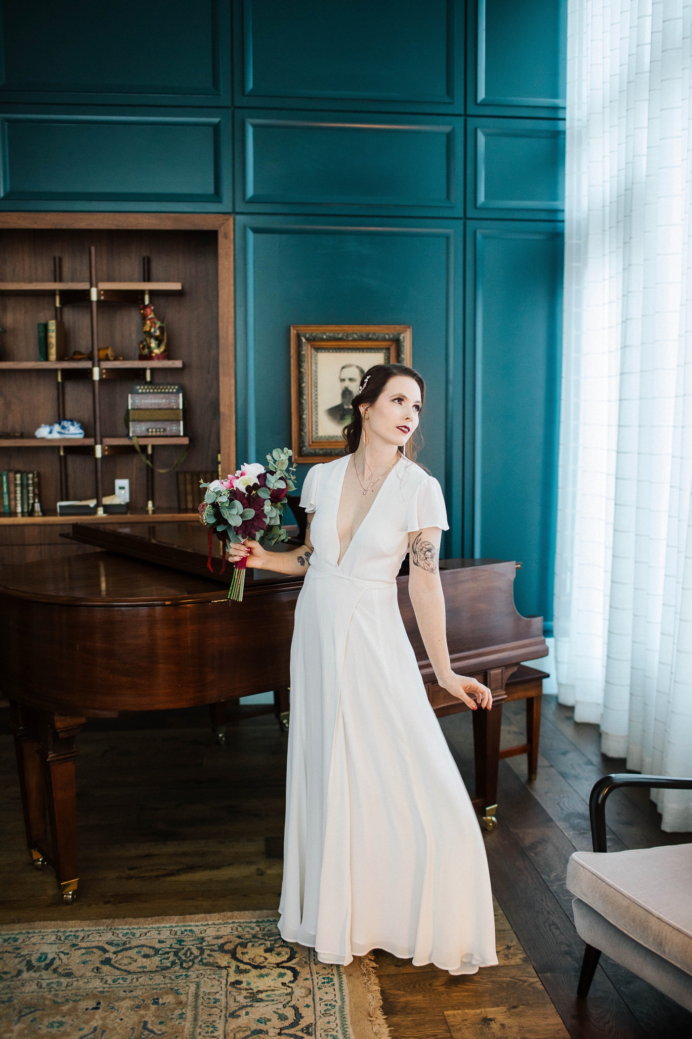 Bride in a chiffon wedding gown from Reformation