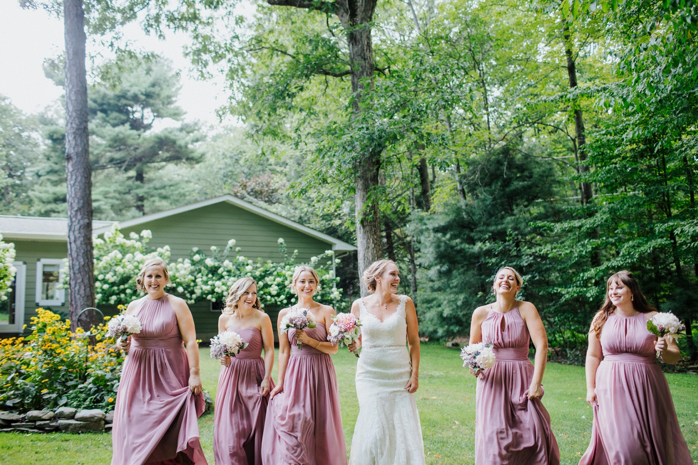 Bridesmaids in Wisteria chiffon gowns by Allure Bridesmaids