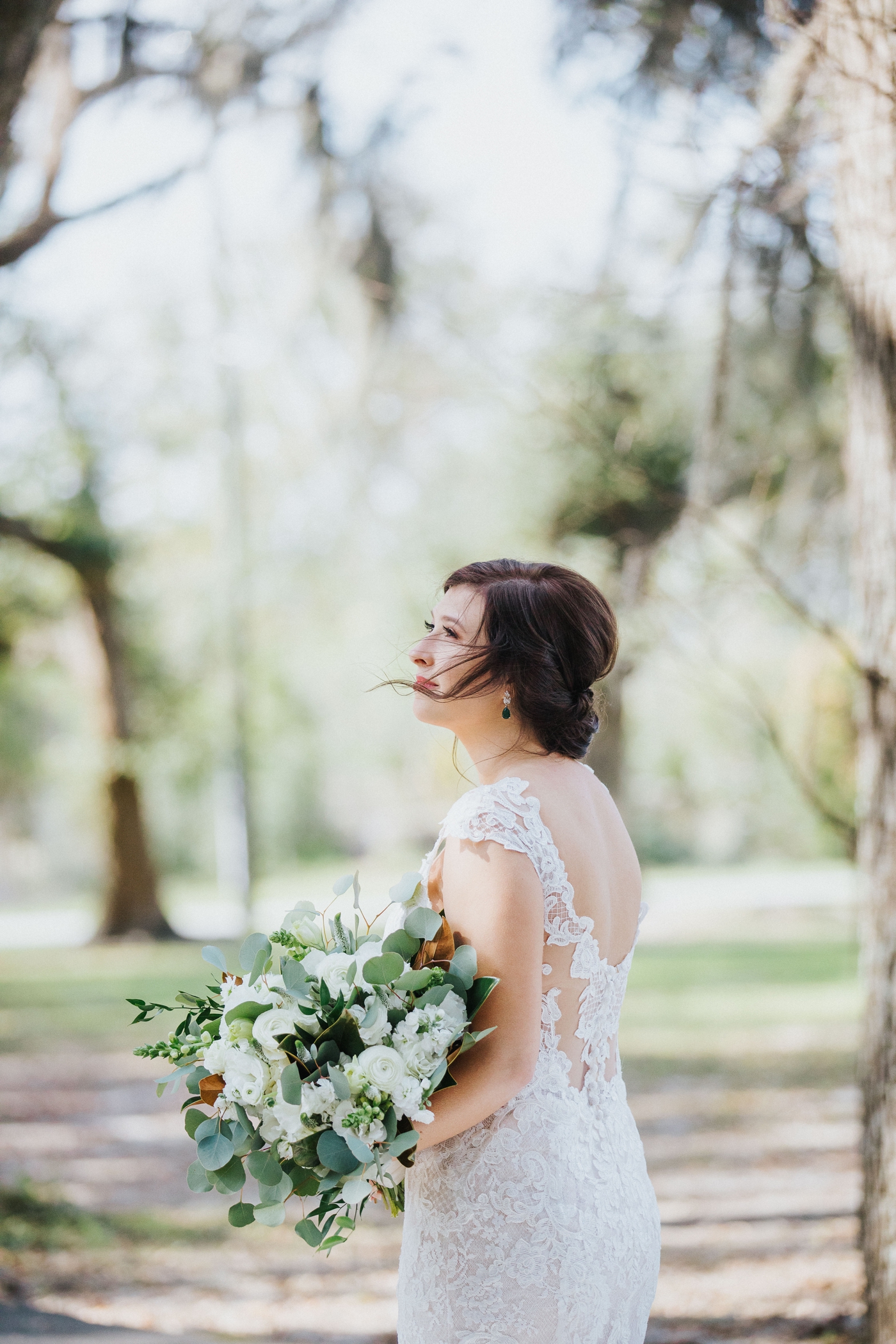 Bride in a lace gown by Sottero and Midgley
