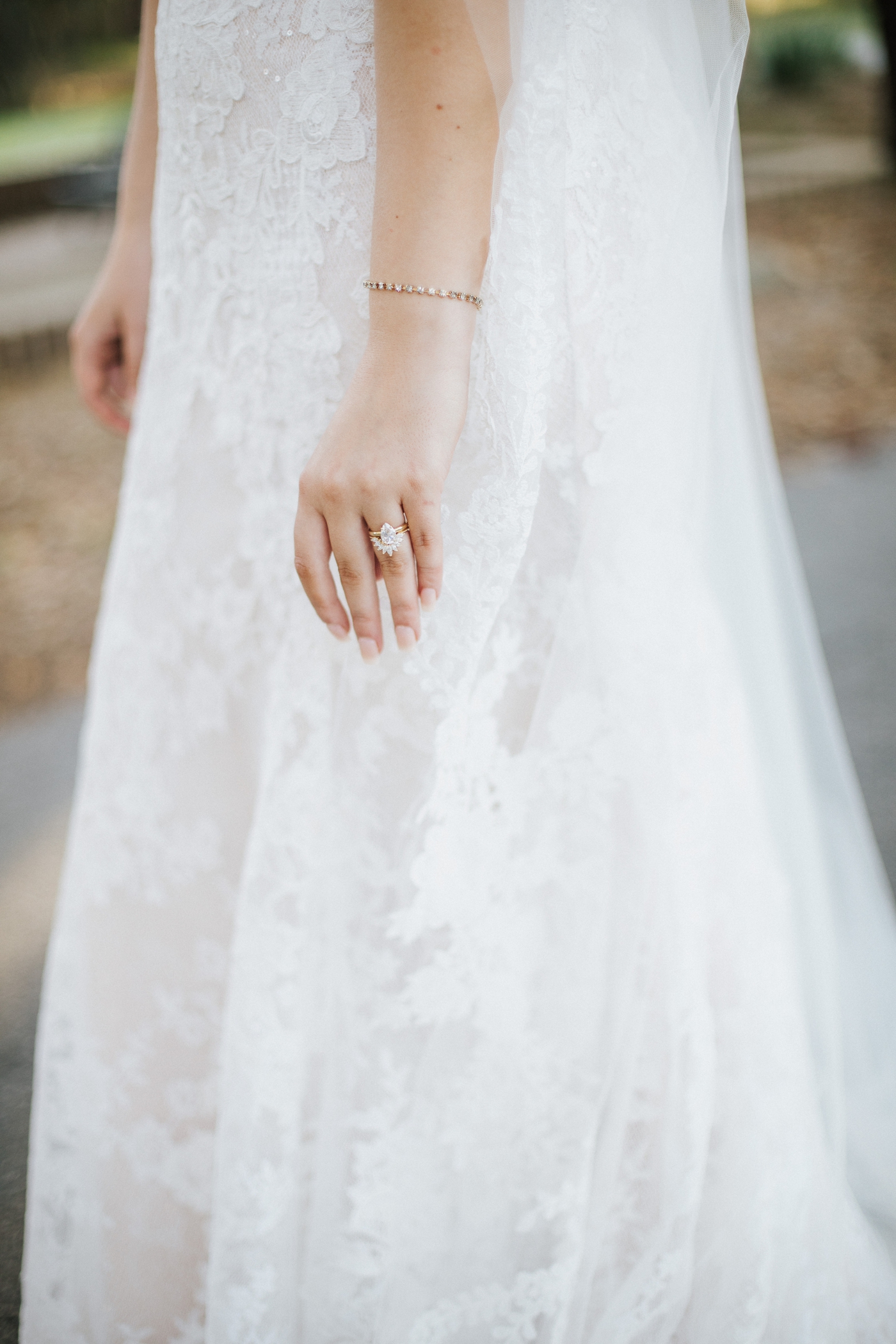 Bride in a lace gown by Sottero and Midgley
