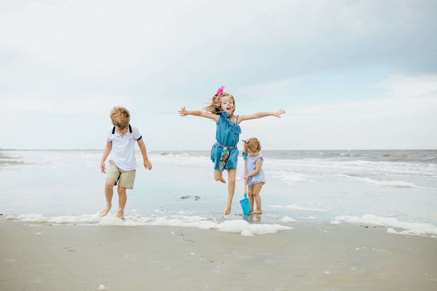 A cute family photo shoot on the beach at sunset on the Golden Isles in Georgia.