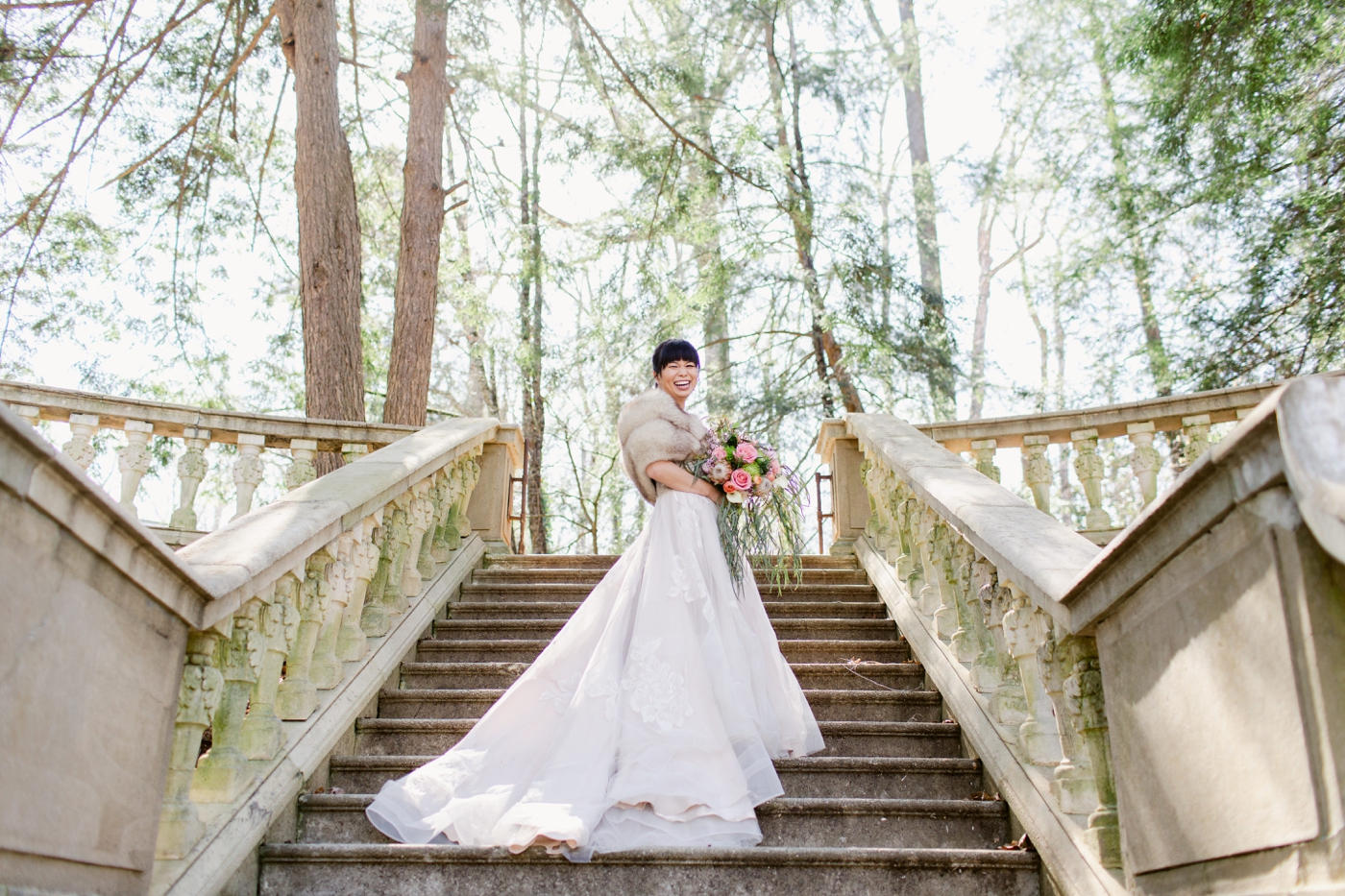 Bride in a lace ballgown from BHLDN in Atlanta with a fur shawl