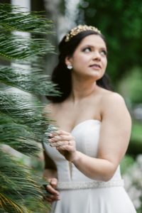 Bride in a crepe strapless ballgown by Christina Wu