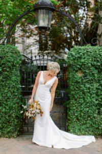 Bride in a classic satin gown by Justin Alexander