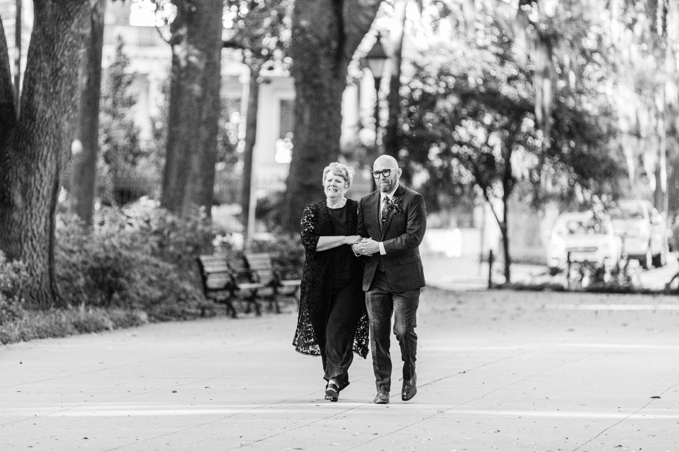 Groom walking down the aisle with his mother at Forsyth Park