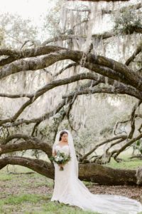 bridal portrait under large trees in Savannah