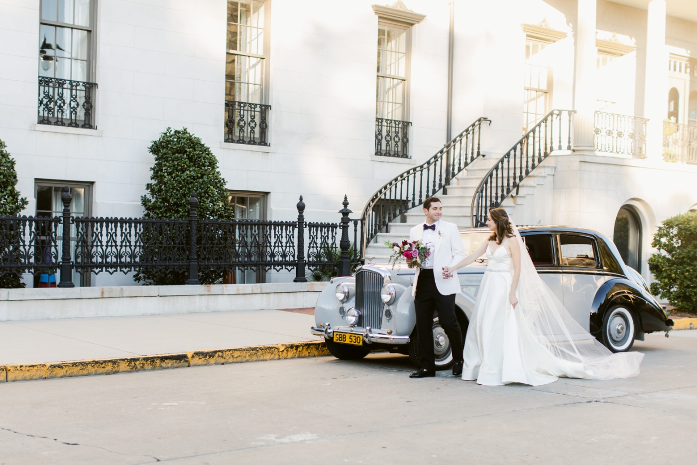 bride and groom with Callan's Classic car