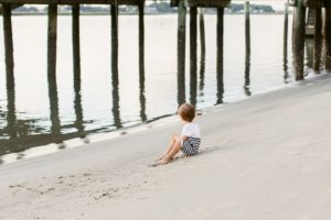 kid playing on beach