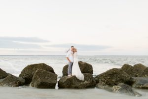 wedding portraits on beach rocks