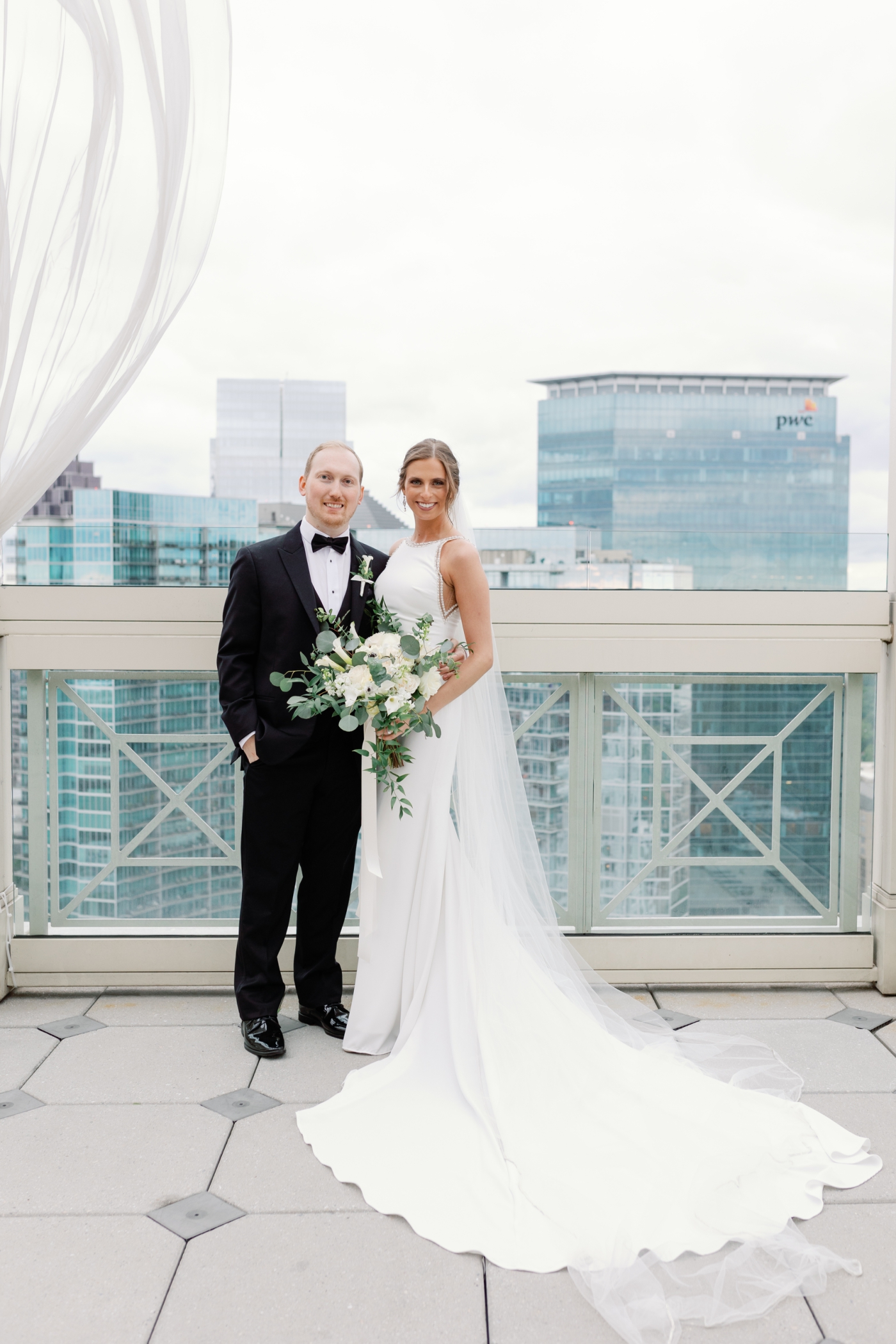 bride and groom portraits with Atlanta skyline