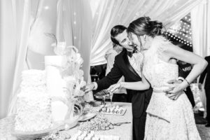 bride and groom cutting the cake