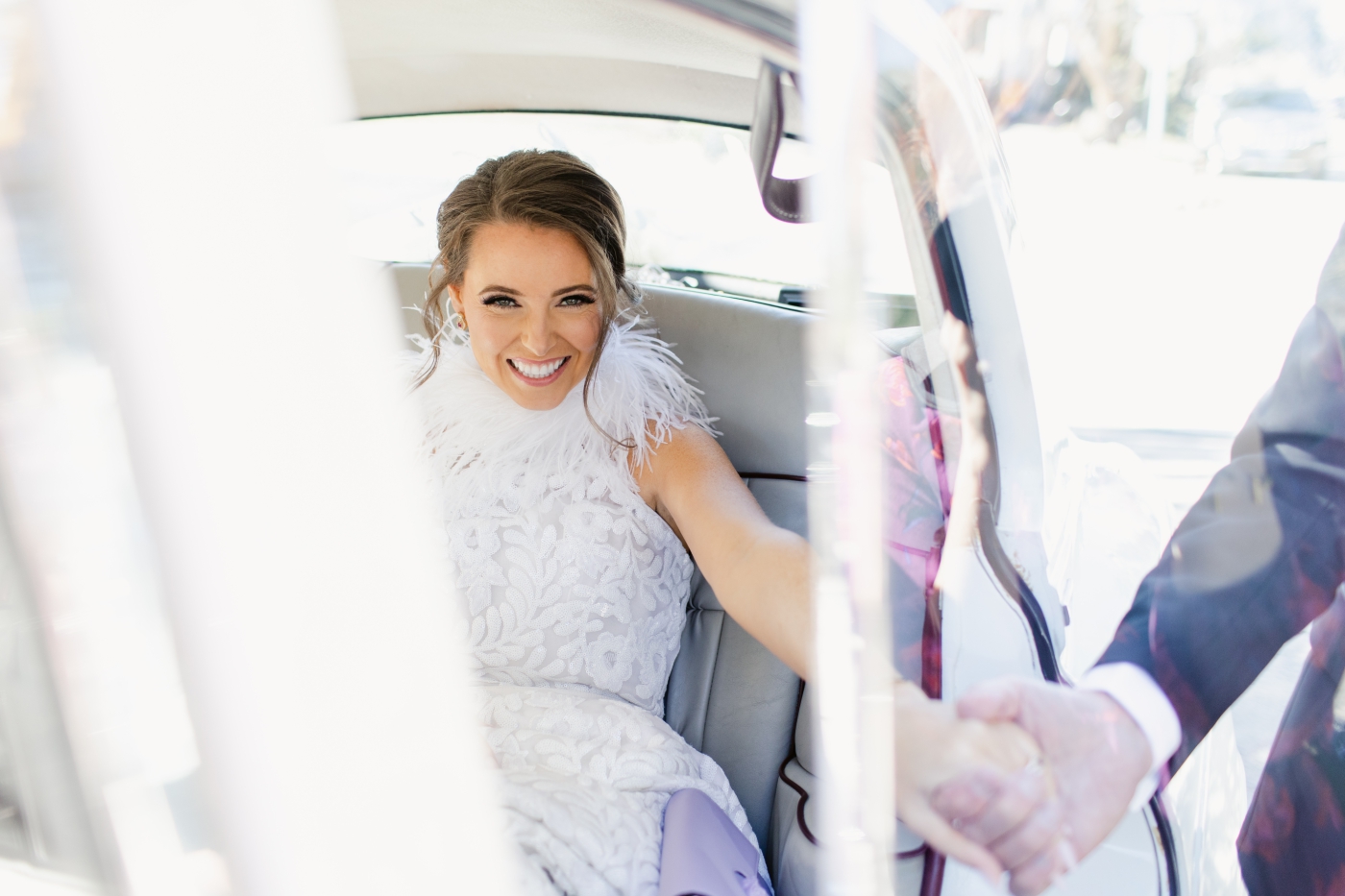 bride getting out of classic car