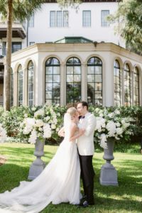 white flowers and greenery ceremony decor