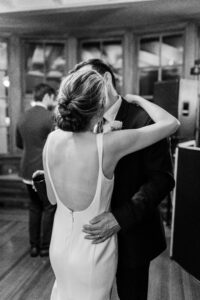 Bride and groom kissing during their first dance.