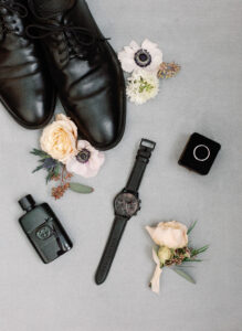 A watch and shoes and cologne.
