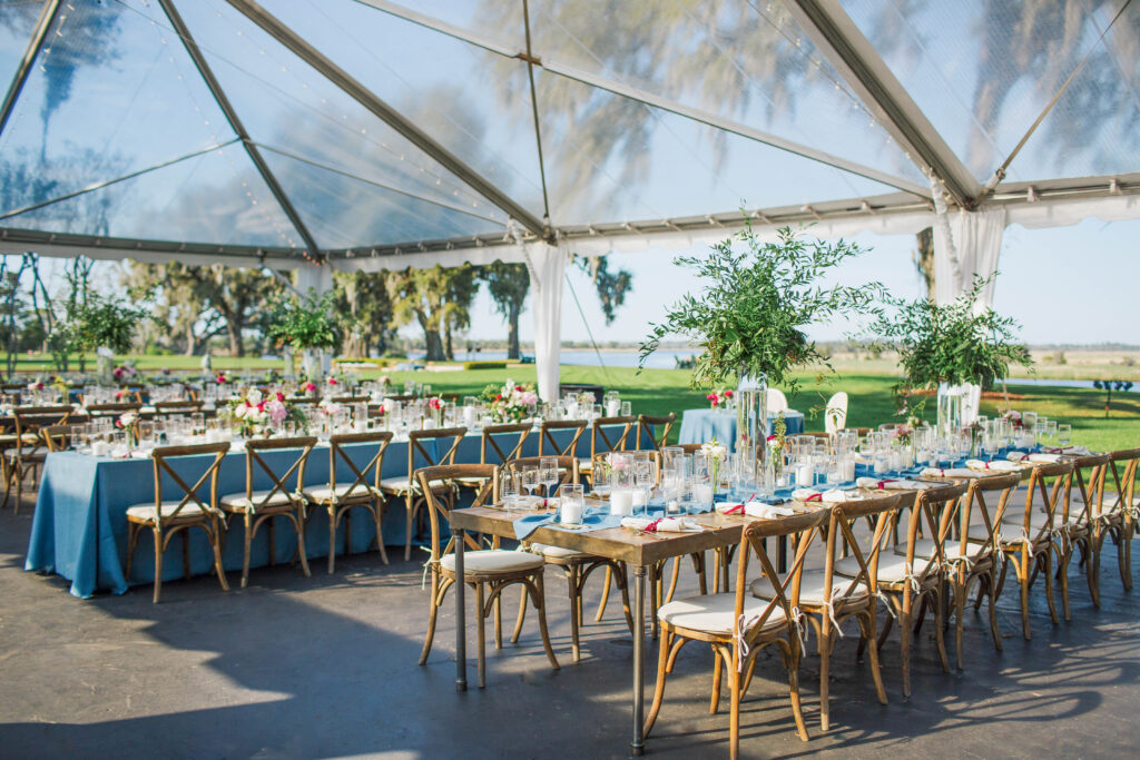 Tables at a tented reception. 