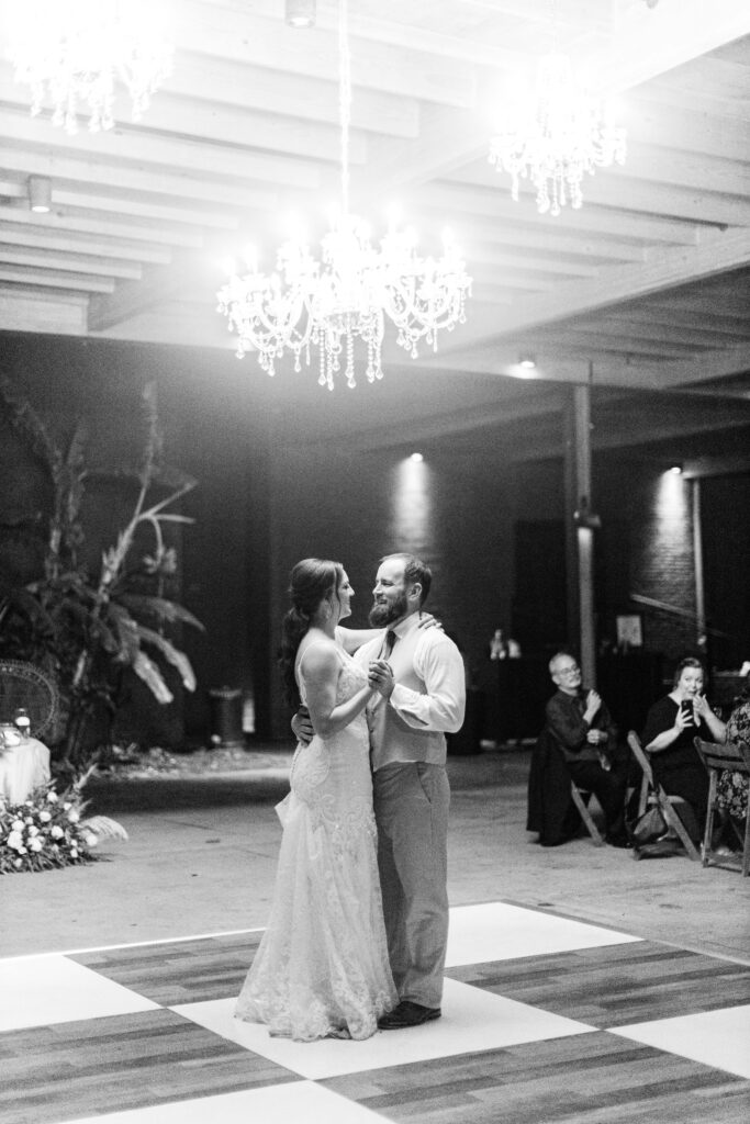 A bride and groom share a first dance. 