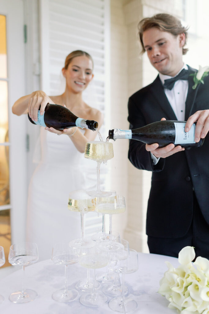 Bride and groom pouring Champagne tower